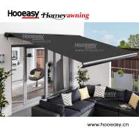 Double sided motorized retractable sunshade awnings and canopies